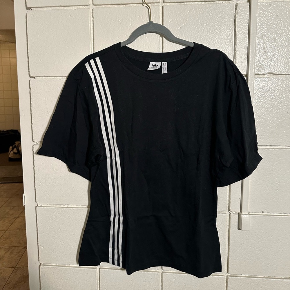 Brand new Adidas women’s shirt with Classic Stripe Design